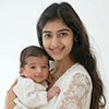 Mother and her newborn baby white background